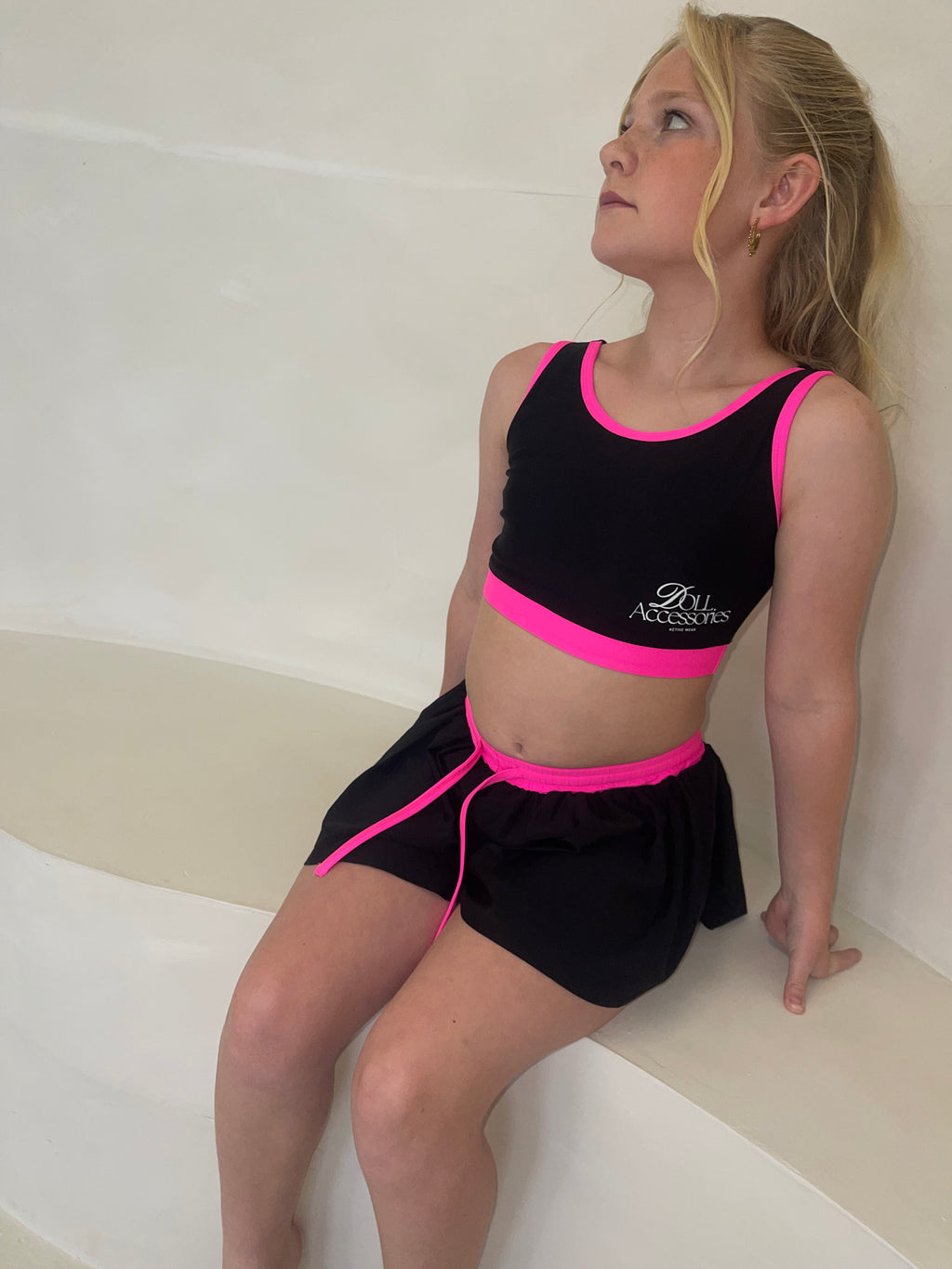neon pink & black backless bow crop and spinning shorts set