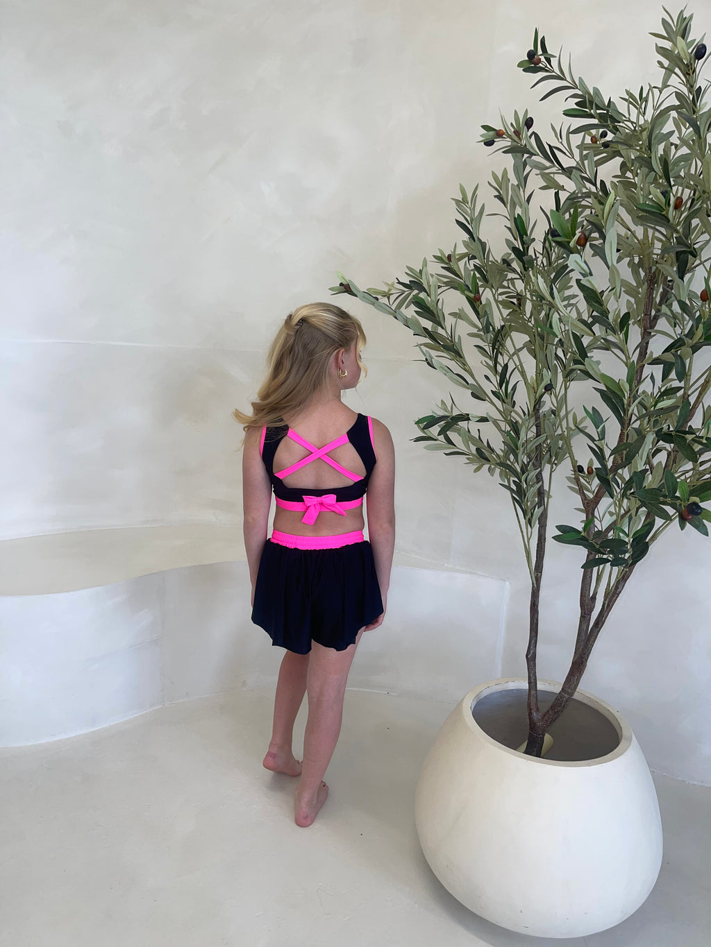 neon pink & black backless bow crop and spinning shorts set